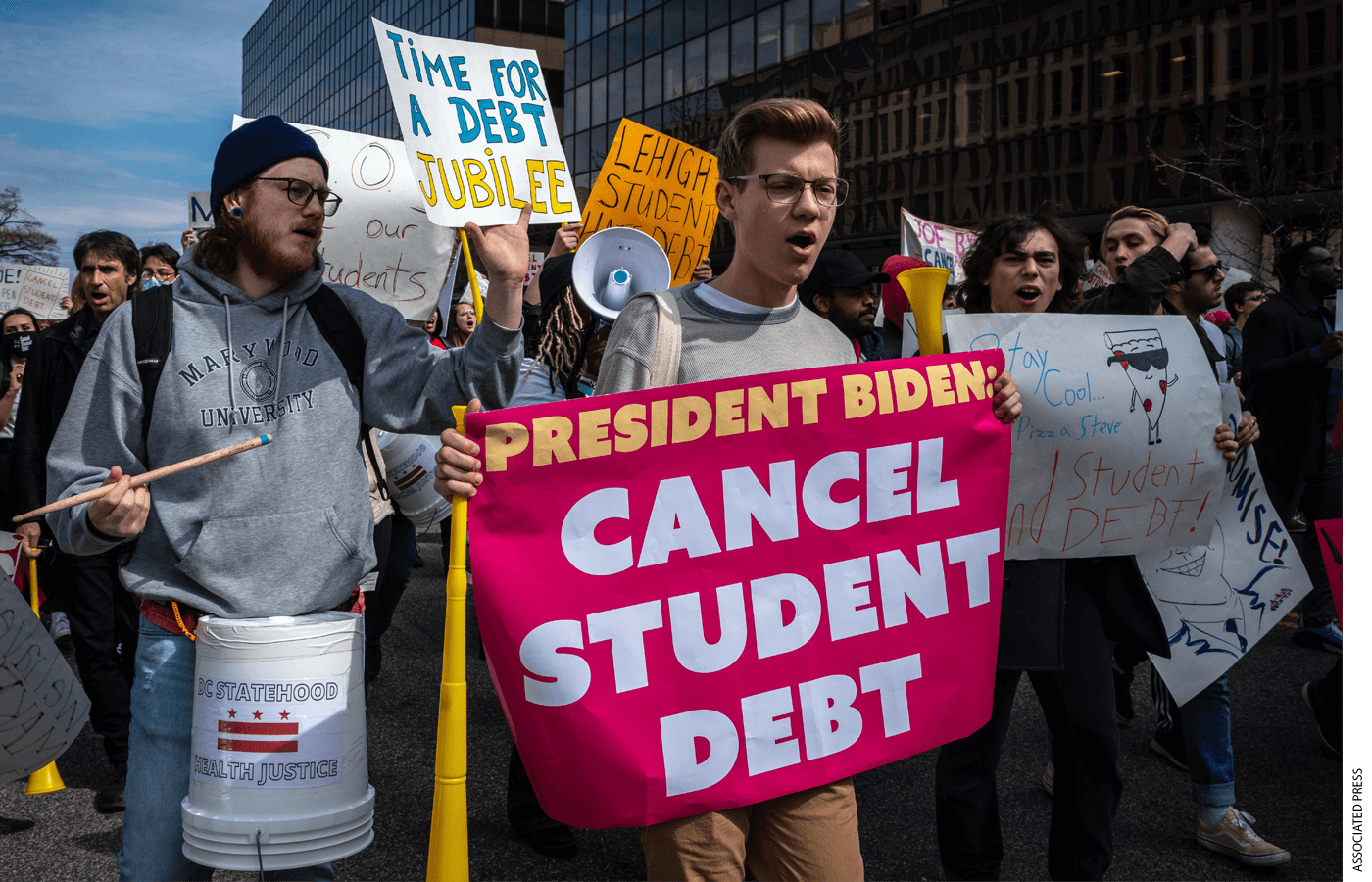 People march against student debt around the U.S. Department of Education in Washington, D.C. on April 4, 2022. Members of the Debt Collective, which describes itself as a borrowers' union, called for President Joe Biden to abolish all student loan debt by executive order.