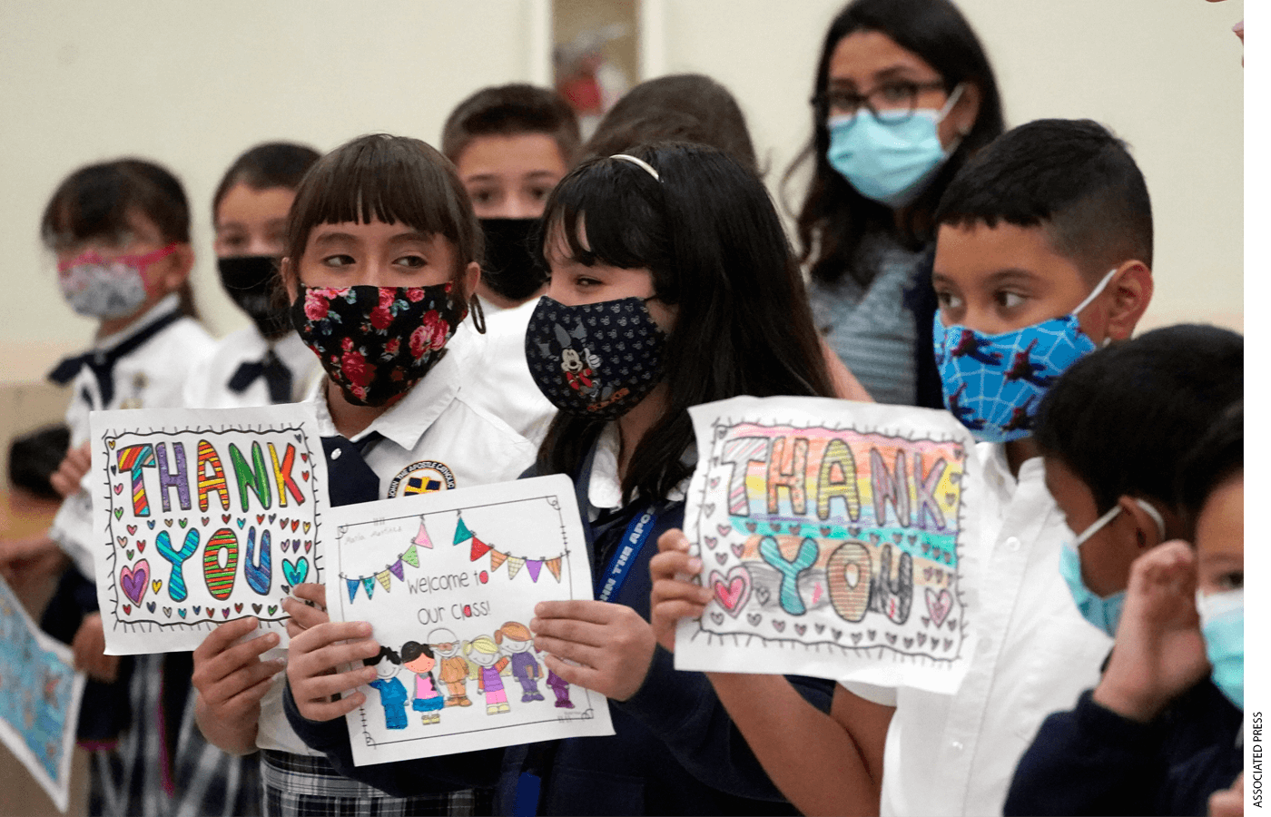 Children wait for Florida Governor Ron DeSantis to arrive at a bill signing ceremony at St. John the Apostle School, Tuesday, May 11, 2021, in Hialeah, Fla.