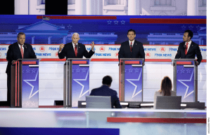 Former Vice President Mike Pence speaks as from left, former New Jersey Gov. Chris Christie, Florida Gov. Ron DeSantis and businessman Vivek Ramaswamy listen during a Republican presidential primary debate hosted by FOX News Channel Wednesday, Aug. 23, 2023, in Milwaukee.