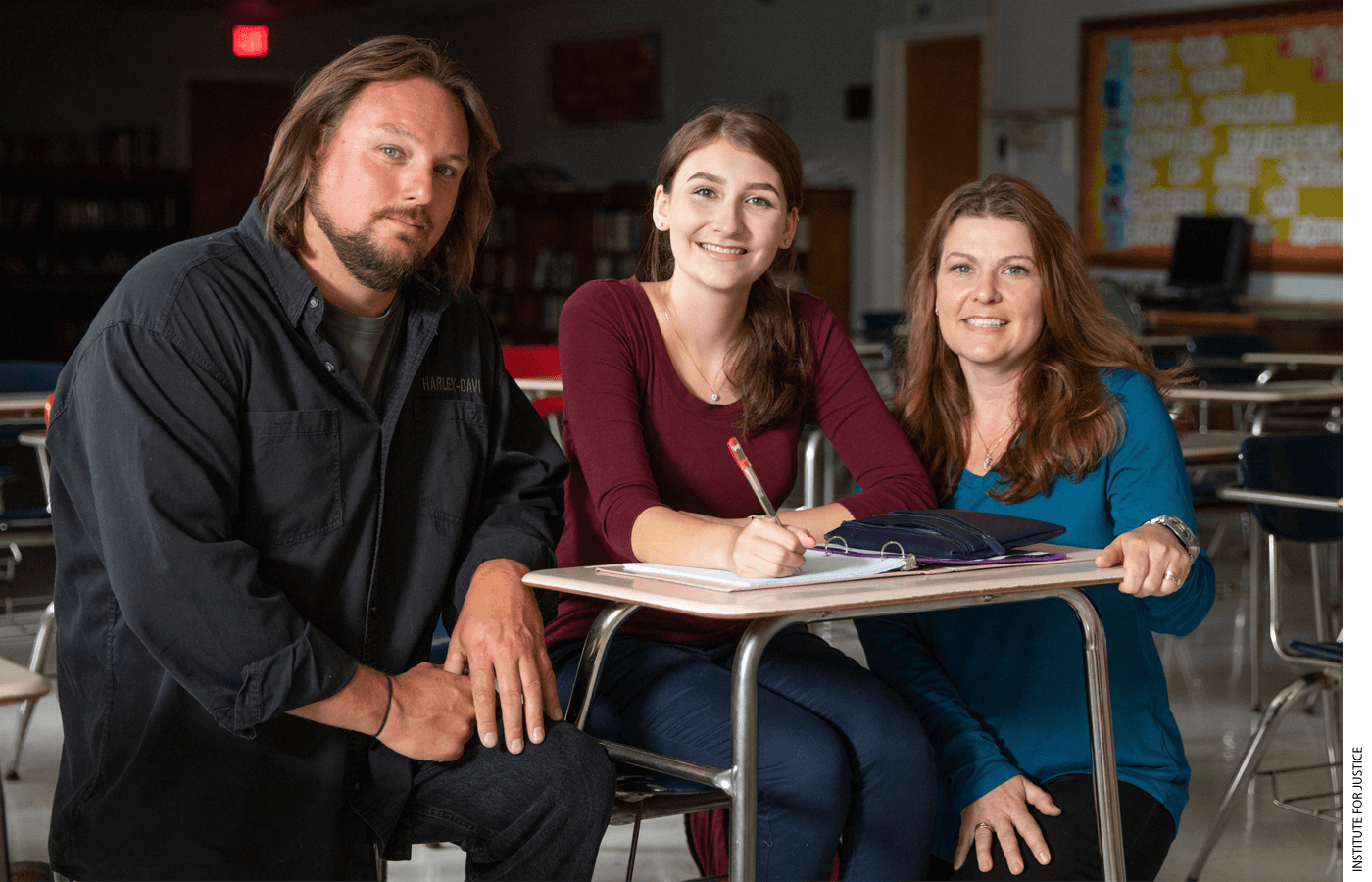 Dave and Amy Carson with their daughter at Bangor Christian Schools in Maine. The Carsons are one of three families that sued Maine over a program that bans families from an otherwise generally available student-aid program if they choose to send their children to schools that teach religion. (Photo by the Institute for Justice www.ij.org.)