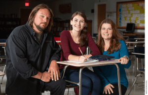 Dave and Amy Carson with their daughter at Bangor Christian Schools in Maine. The Carsons are one of three families that sued Maine over a program that bans families from an otherwise generally available student-aid program if they choose to send their children to schools that teach religion. (Photo by the Institute for Justice www.ij.org.)