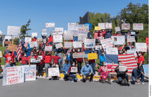 About 200 people protested the removal of merit-based admissions at Thomas Jefferson High School for Science and Technology in Virginia. The author is in the front, in pink.