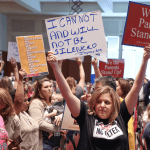 Parents protest at a meeting of the Loudoun County School Board in Ashburn, Virginia.