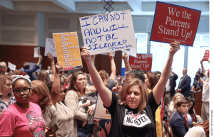 Parents protest at a meeting of the Loudoun County School Board in Ashburn, Virginia.