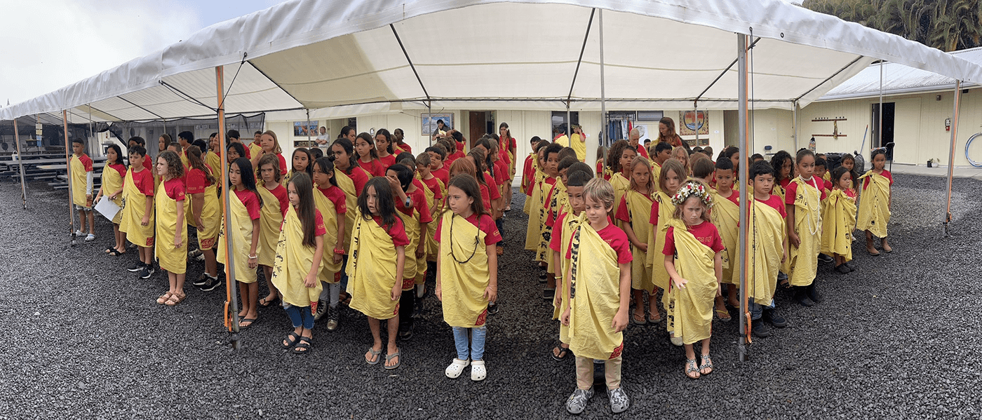 Students perform their morning wehena, or protocol, a practice of unifying hearts and minds and calling upon the wisdom of ancestors.