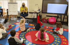 Kindergarten teacher Julie Mackett conducts her class at Ft. Meigs Elementary School, in Perrysburg, Ohio.