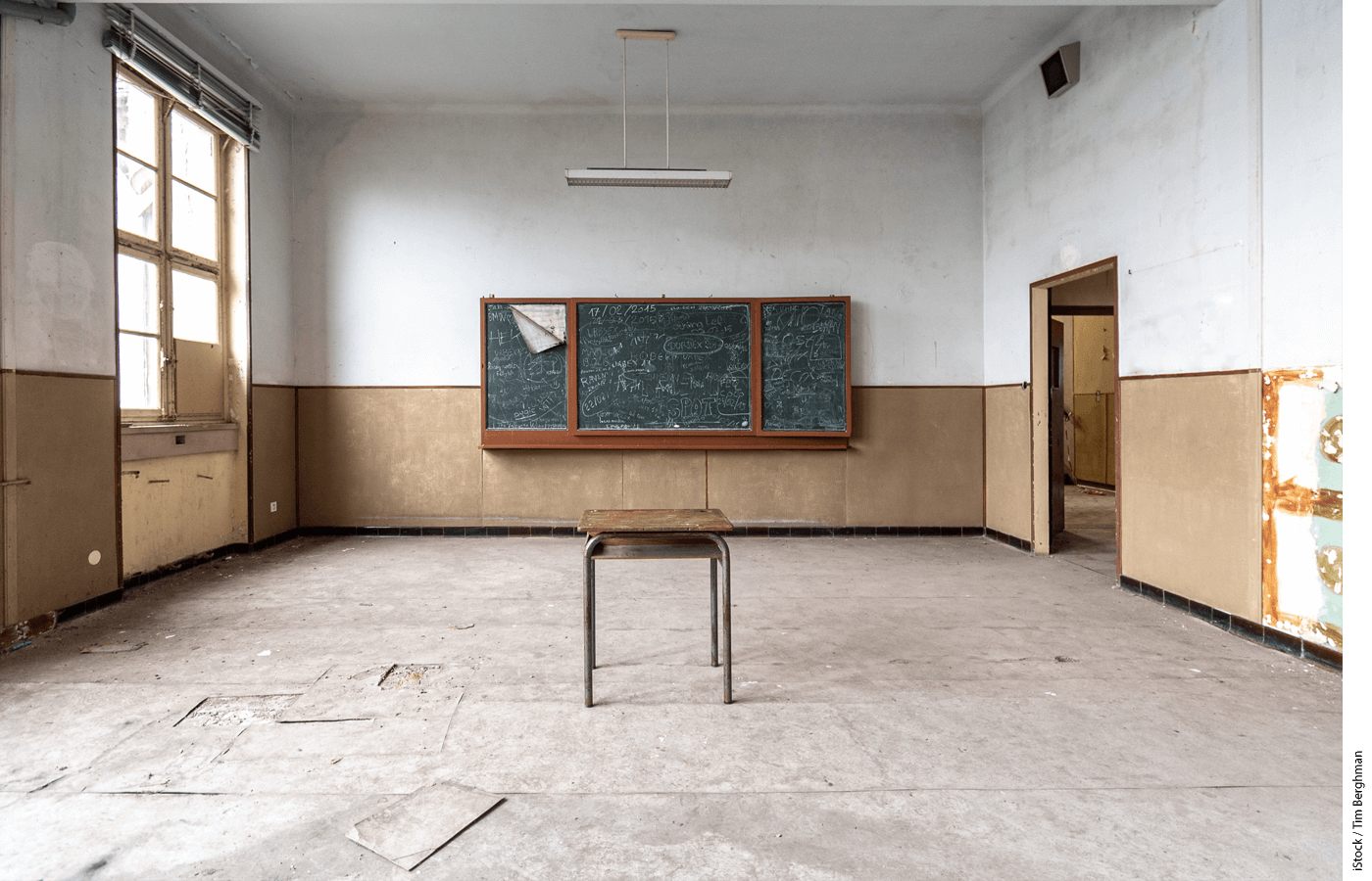 One desk in an empty classroom