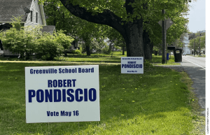 Campaign signs for Robert Pondiscio on a lawn