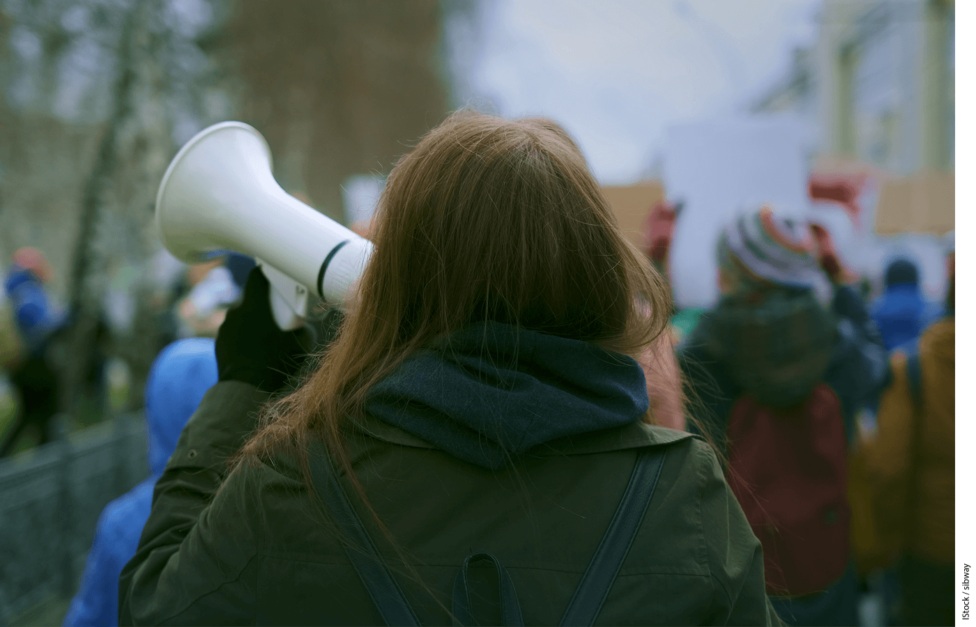 Photo of a young woman demonstrating at a protest