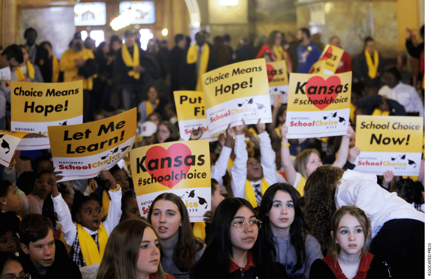 Private and home school students, their parents and advocates crowed part of the second floor of the Kansas Statehouse for a rally on education, Wednesday, Jan. 25, 2023, in Topeka, Kansas.