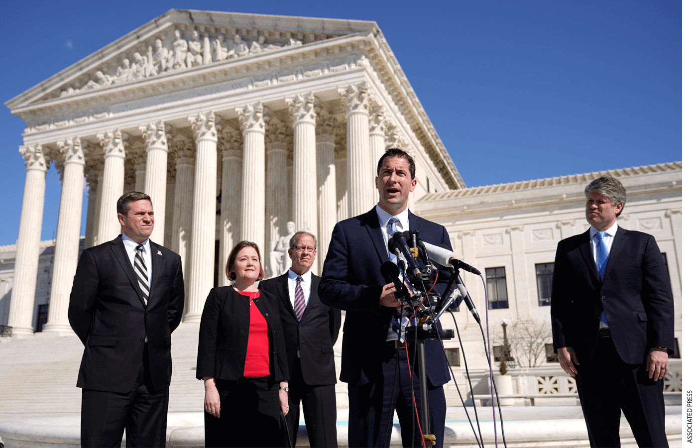 Nebraska Solicitor General Jim Campbell speaks with reporters outside the Supreme Court on Capitol Hill in Washington, Tuesday, Feb. 28, 2023, after arguing before the court against President Joe Biden's student debt relief plan. Standing behind Campbell are Missouri Attorney General Andrew Bailey, from left, Iowa Attorney General Brenna Bird, Ray Wagner of the Missouri Attorney General's office and Nebraska Attorney General Mike Hilgers.