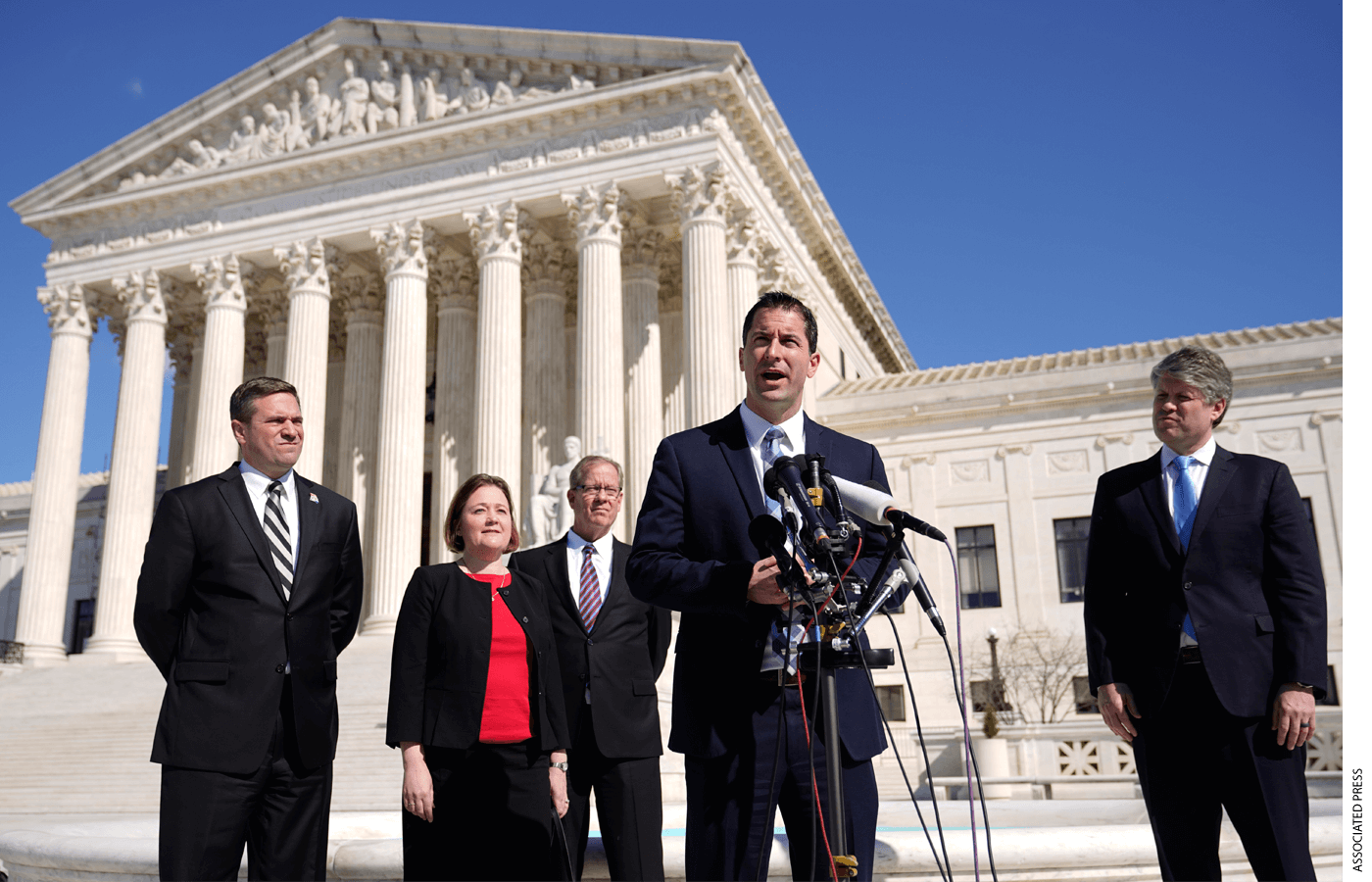 Nebraska Solicitor General Jim Campbell speaks with reporters outside the Supreme Court on Capitol Hill in Washington, Tuesday, Feb. 28, 2023, after arguing before the court against President Joe Biden's student debt relief plan. Standing behind Campbell are Missouri Attorney General Andrew Bailey, from left, Iowa Attorney General Brenna Bird, Ray Wagner of the Missouri Attorney General's office and Nebraska Attorney General Mike Hilgers.