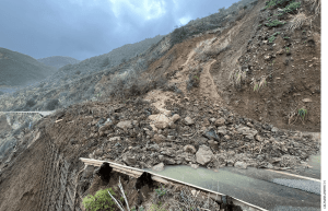 Rocks and mud cover HIghway 1 in California